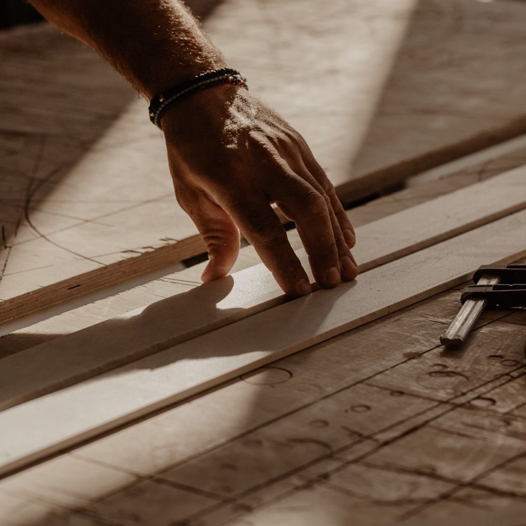 Craftsman carefully measuring wood